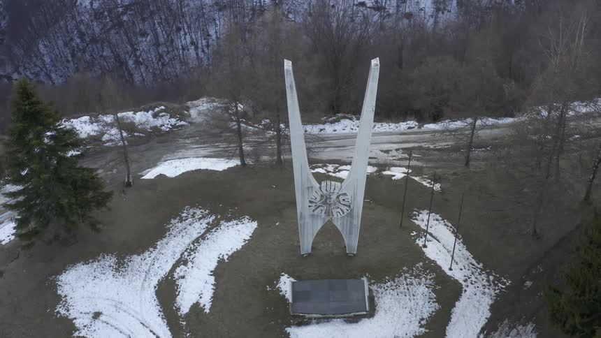 An aerial view of a statue in a park