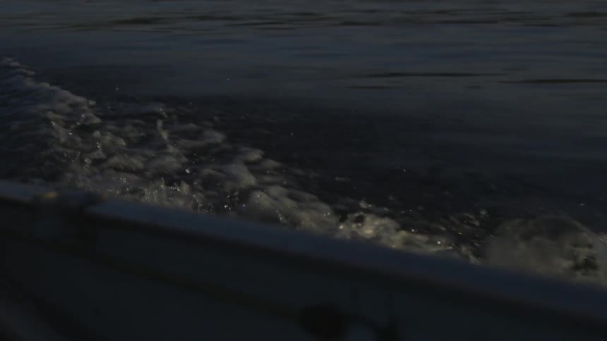 Water splashes as a boat travels