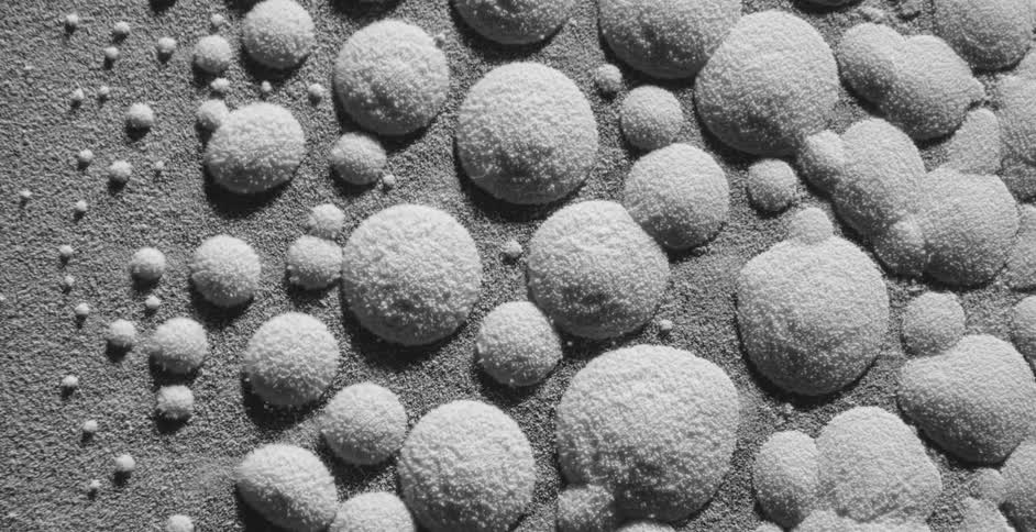 White crumbly bubbles form and move as they vibrate
