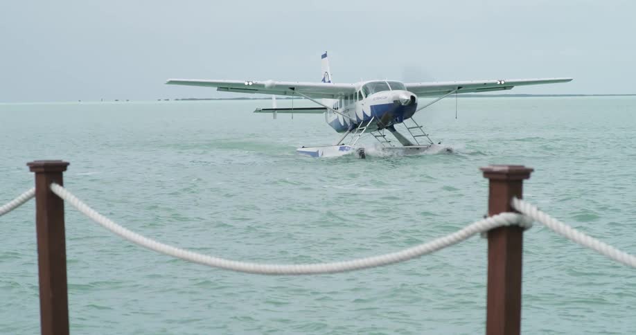 Hydroplane floating on the surface of the ocean near a pier