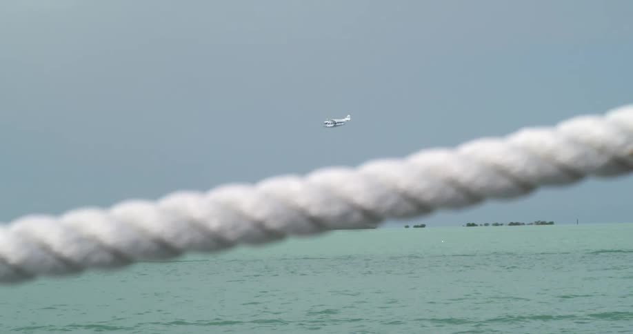 An airplane flying over the ocean