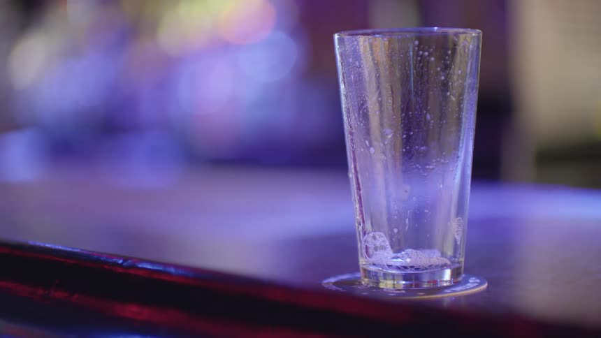 A view of a shot glass on a coaster
