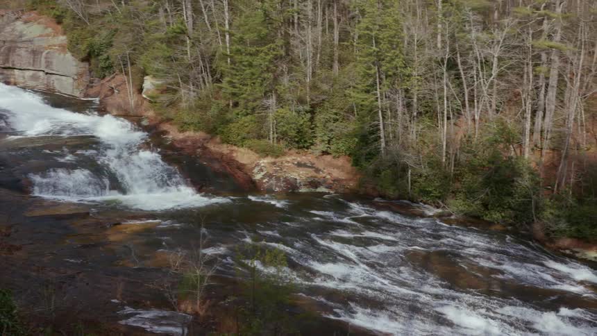 A water fall in the middle of a forest