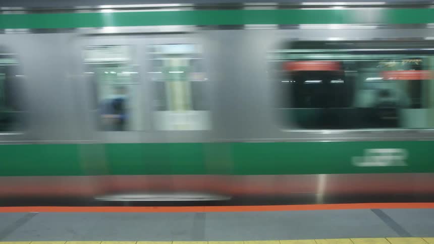 Metro train driving by the metro stations platform