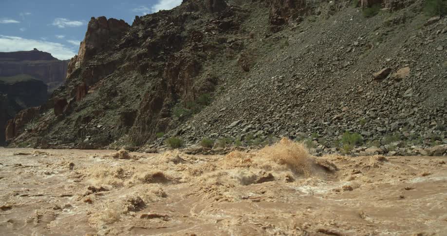 Slow motion shot of massive waves exploding on the Colorado River in the Grand Canyon National Park located in the American Southwest before flowing downstream to Phoenix and California
