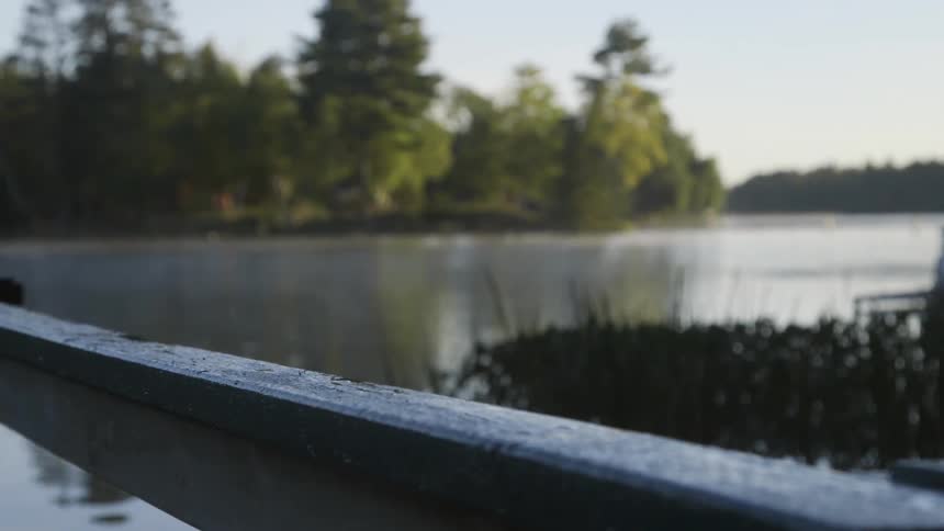 View off the side of a boat into a lake