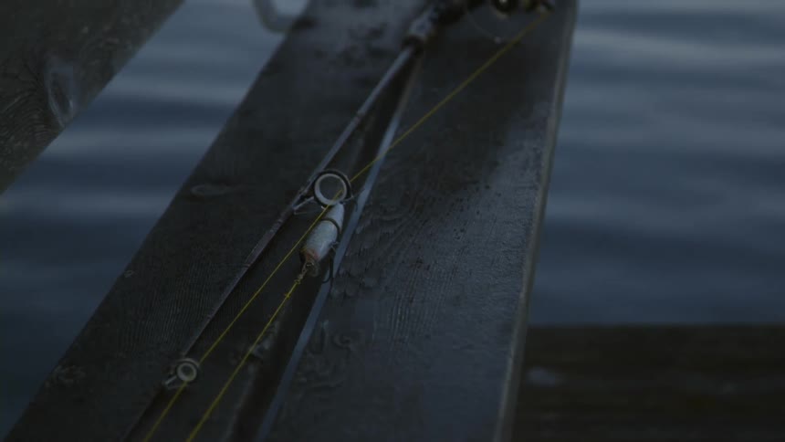 Close up of a fishing pole laying down