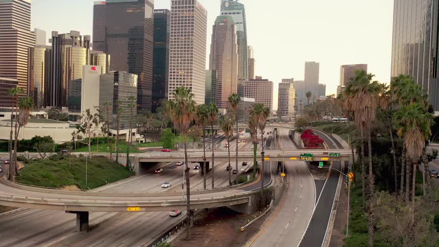 Aerial of commuters on a freeway in the city