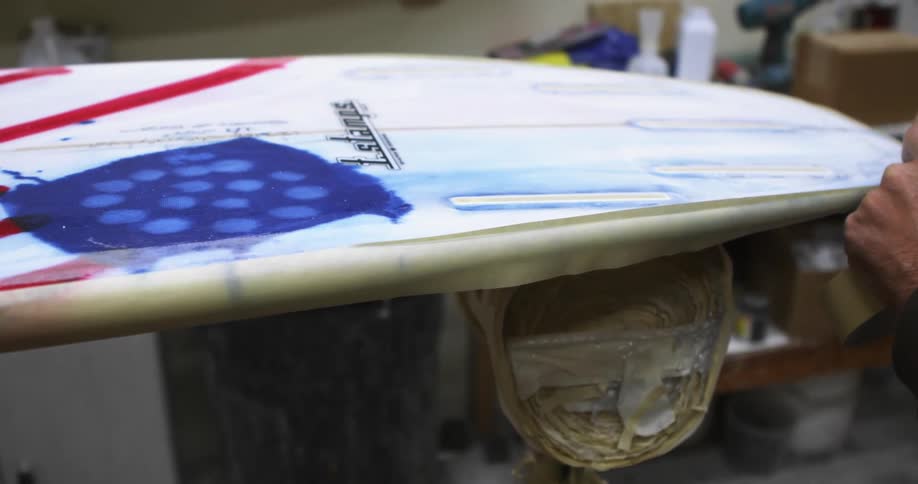 A person working on a product in a shop