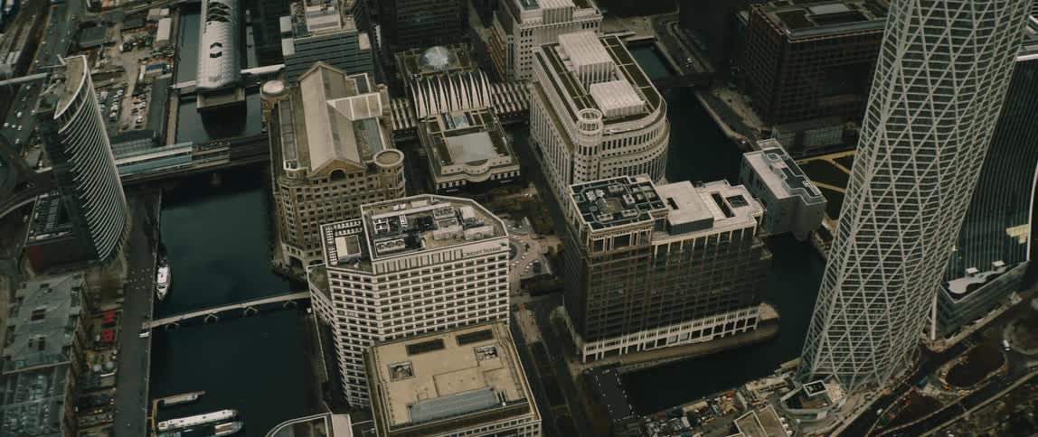 Aerial view of London with roads vehicles buildings and skyscrapers