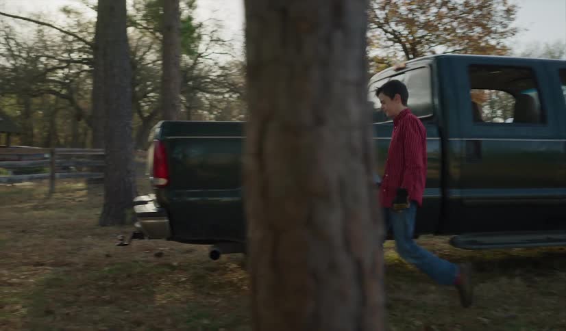 A father and son exit the truck
