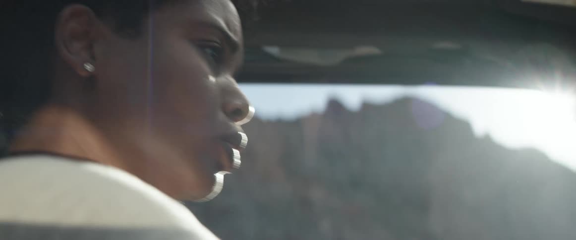 A woman driving a car and crying