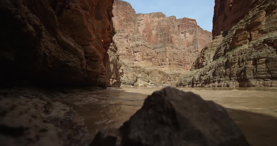 Colorado River water swirls and churns deep in the Grand Canyon after a heavy thunderstorm in the American Southwest