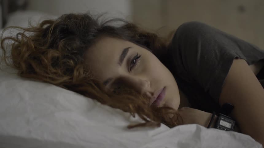 A woman laying in bed