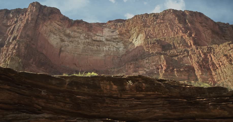 Very pleasing slow tracking shot from a whitewater raft deep in Grand Canyon National Park looking up at the South Rim from river level
