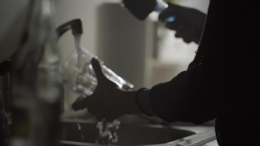 A person washing dishes