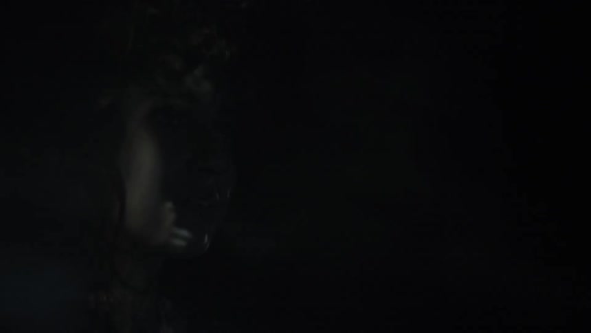 Lights flash on a sad woman's face