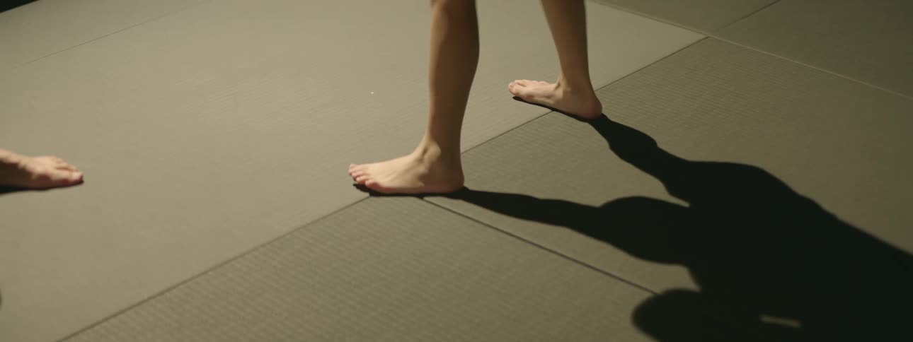 Shadows and feet of kicking and punching