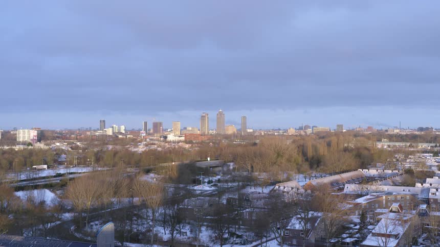 Aerial view of a city is displayed in fall