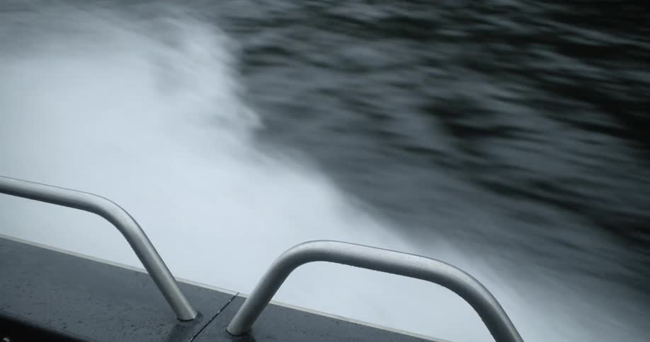 A boat is driving on the ocean water