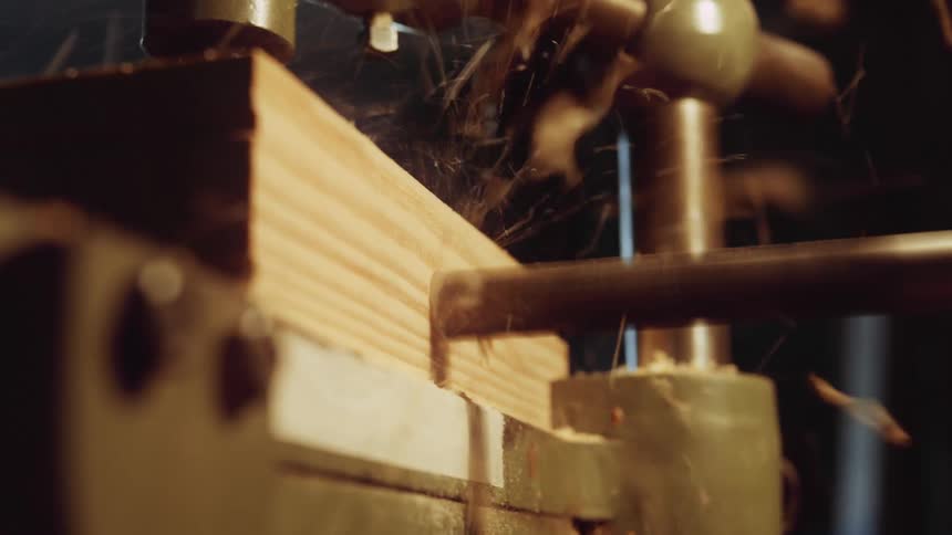 A person is working in a wood shop factory