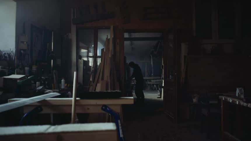 A person is standing in a garage