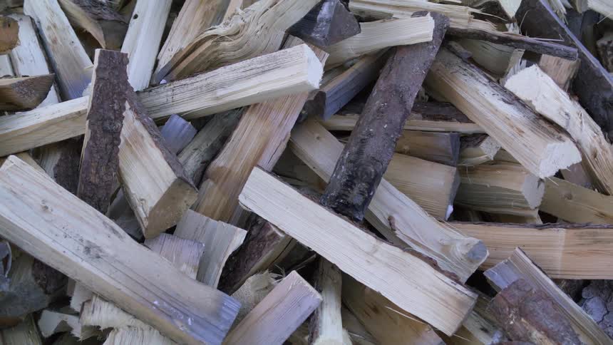 Close up of split wood laying in a pile