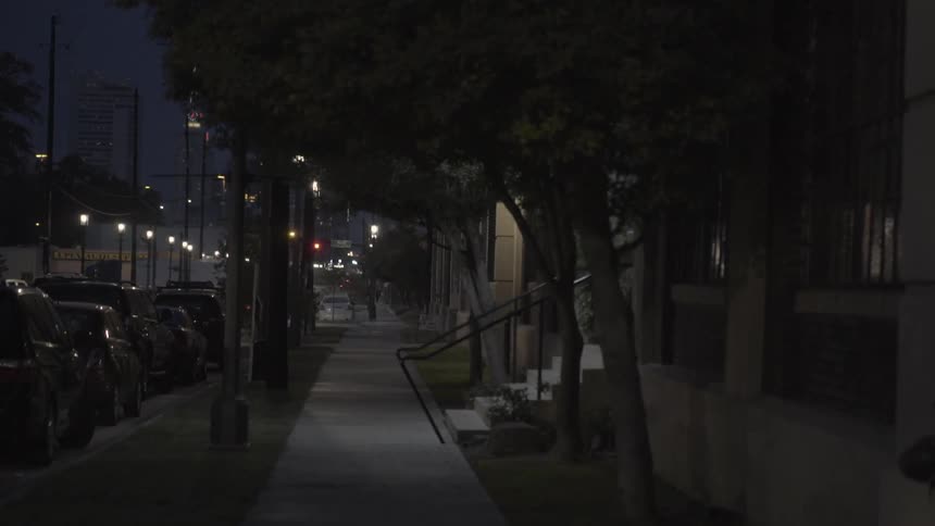 A busy urban mixed use area at night