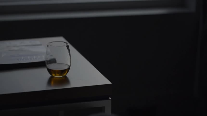 A glass sits on a table