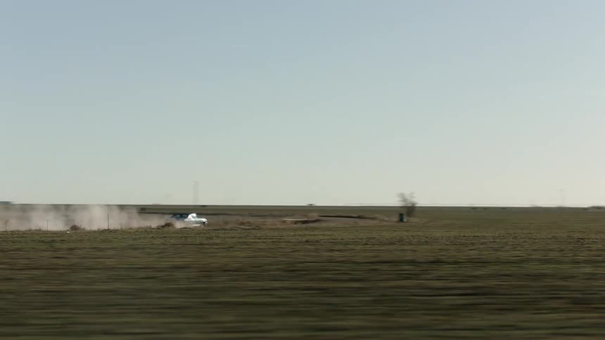 Car speeds through countryside