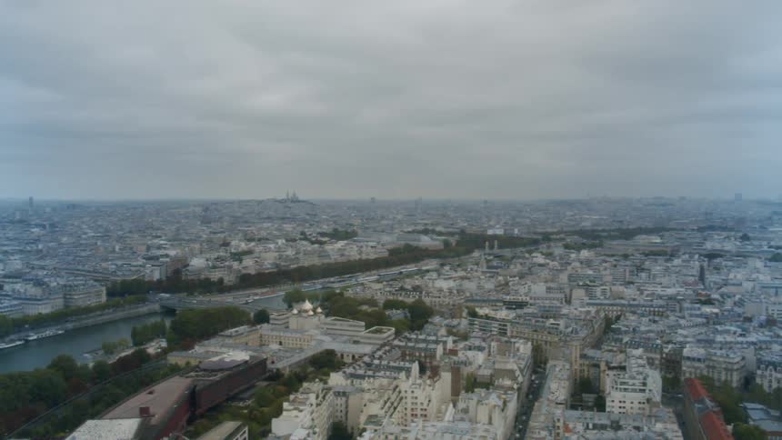 An aerial view of buildings in a city with a river running through it