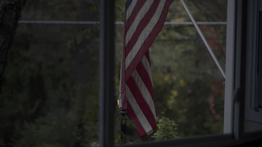 An american flag blowing in a gentle breeze