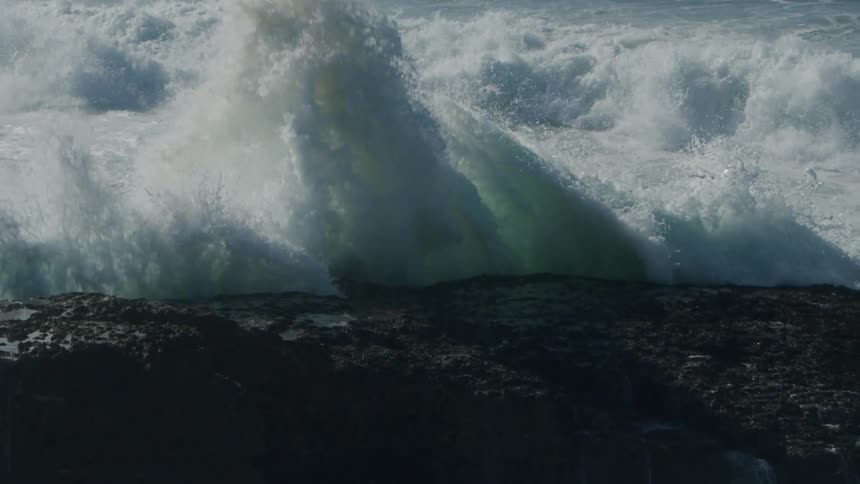 A view of water crashing against the shore