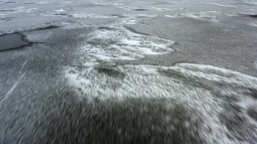 Ice and frost covering a body of water in winter