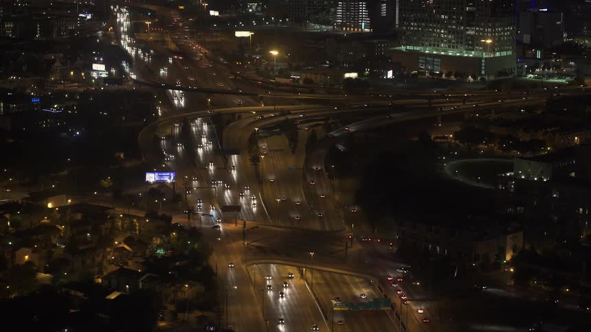Traffic on an urban highway system at night