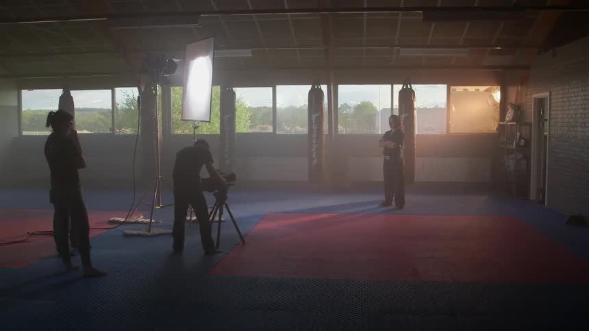 A martial artist posing for a photographer