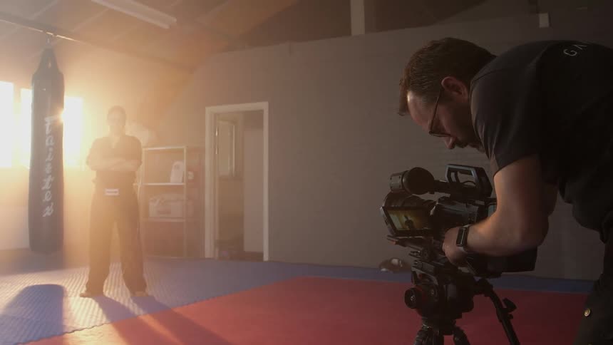A martial artist posing for photographs