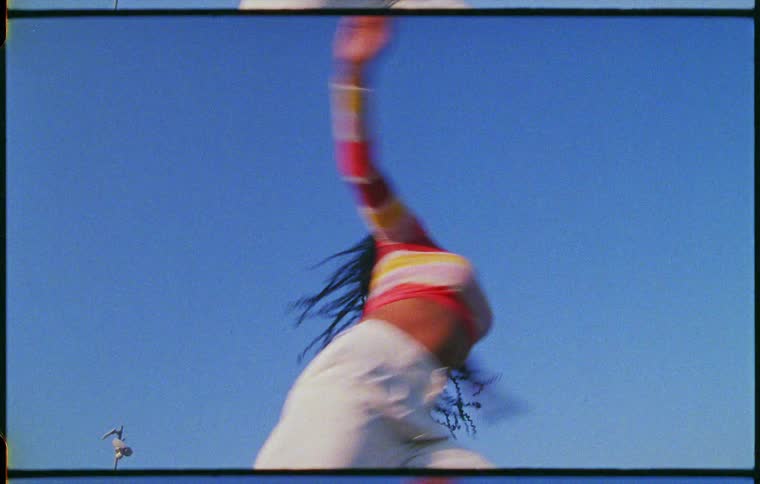 A woman dancing outdoors