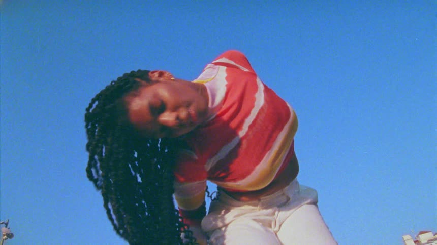 Black woman dancing outdoors