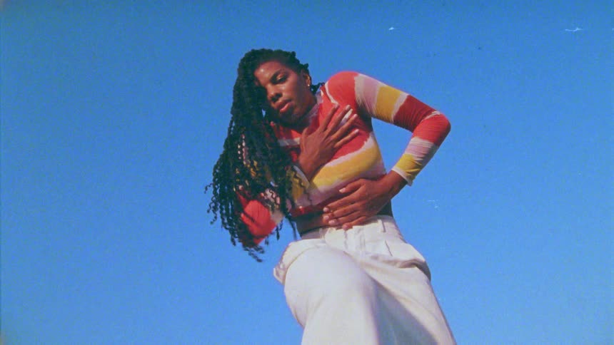A woman dancing outdoors