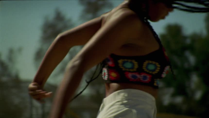A woman that is dancing around outdoors