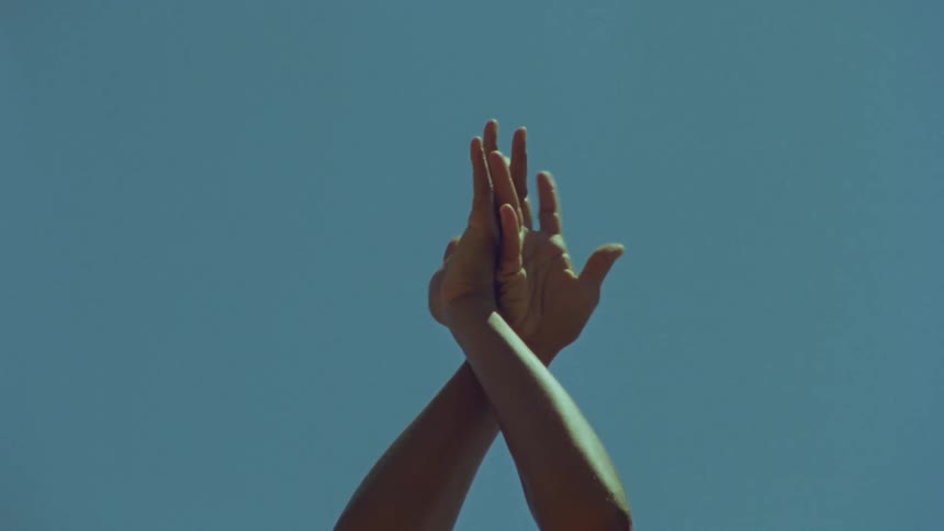 A person moving their hands around dancing