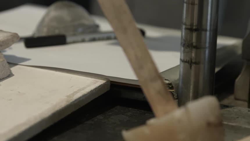 A table is lined with wood and tools