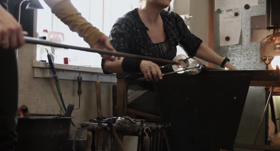 Two female glassmakers working