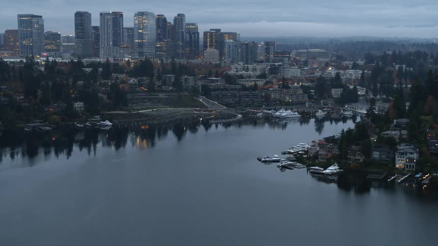 Waterfront homes line the hills in front of the Bellevue skyline