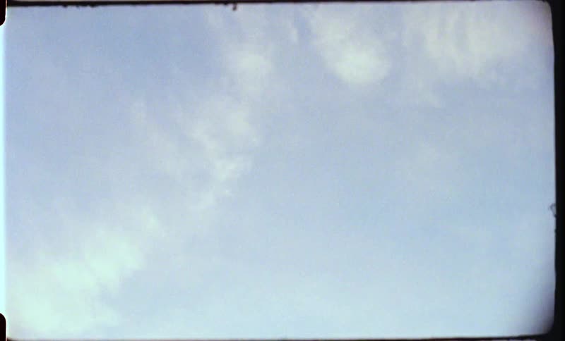 White thin clouds in the blue sky at sunset caught on film