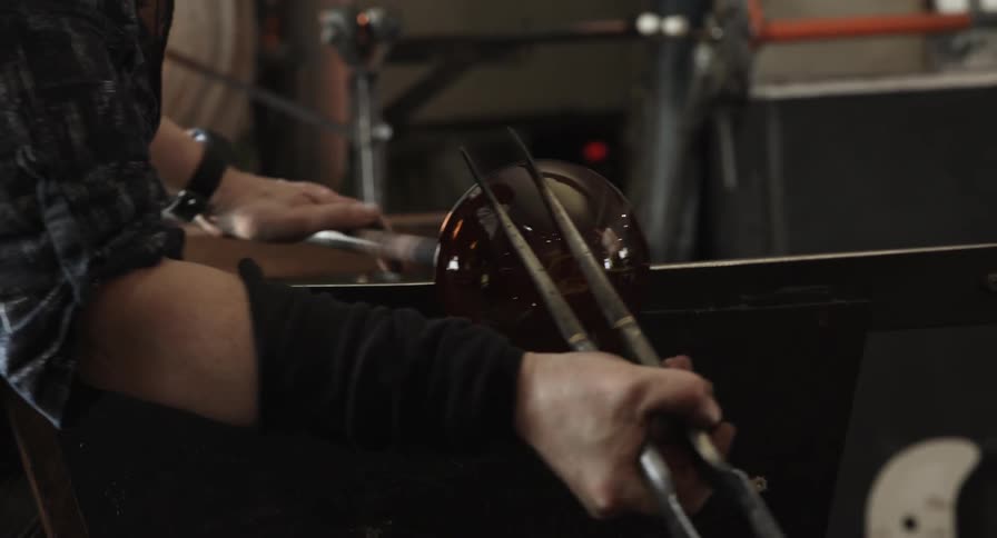 A person working with glass