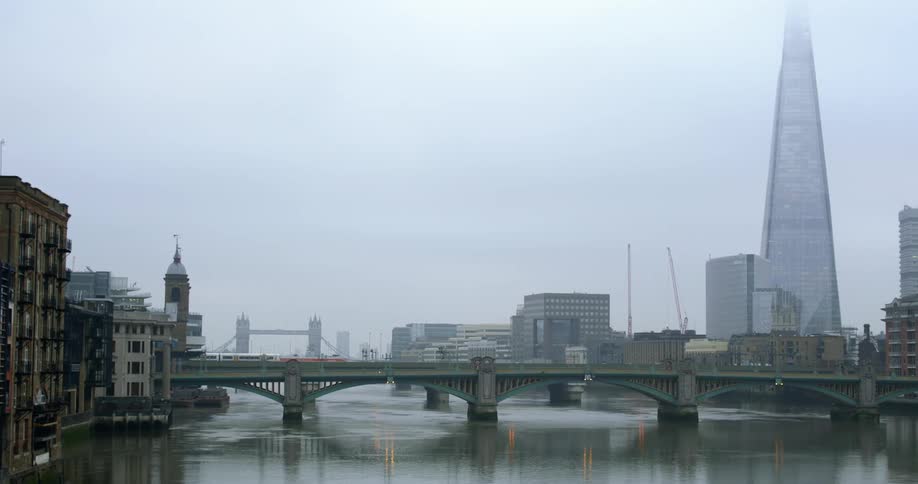 The skyline of the river thames on a misty day