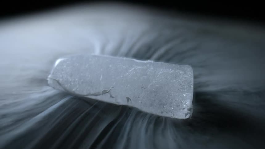 White black and gray colors that look like liquid nitrogen melting