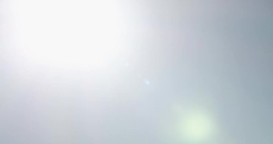 A child is waving around a flashlight in the dark
